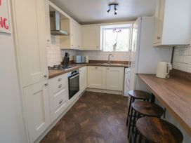 A kitchen with counter space and appliances at 4 Haven Villas in Conwy