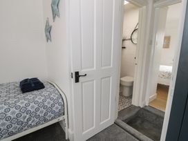 A bathroom with a toilet and sink at 4 Haven Villas in Conwy