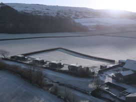 An outdoor area with huts and snow at Low Longlands in Cartmel
