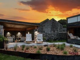 A outdoor seating area with chairs and plants at Middle Longlands in Cartmel