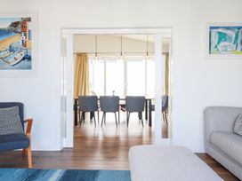 A living room with a sofa and an armchair at Beach Haven in Perranporth