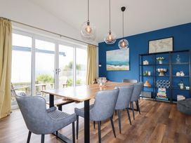 A dining room with a table and chairs at Beach Haven in Perranporth