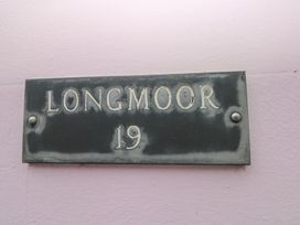 A nameplate with the text Longmoor 19