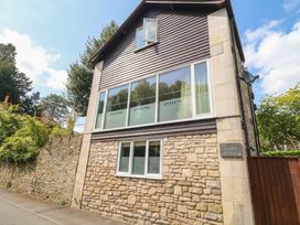 An exterior view of a building with large windows at The Grain Store in Weymouth