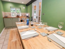 A dining room with a table set for dinner at The Grain Store in Weymouth