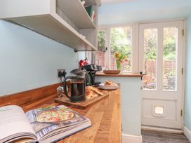 A kitchen with a coffee maker and croissants on the counter at The Grain Store in Weymouth