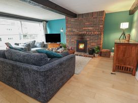 A living room with a sofa and television at The Grain Store in Weymouth