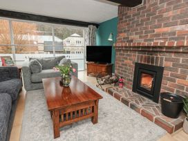 A living room with a sofa and coffee table at The Grain Store in Weymouth