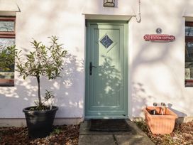 An exterior view of a door and plant at Old Station Cottage in Blaenau Ffestiniog