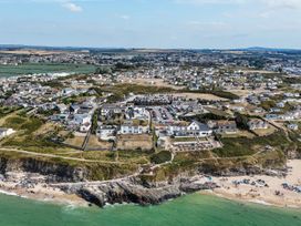 An aerial view of a residential area near a beach at The Sandbox in Hayle