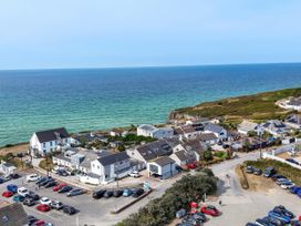 A coastal view with houses and parking at The Sandbox in Hayle