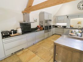 A kitchen with countertops and appliances at Rookery Hall near Middle Hill