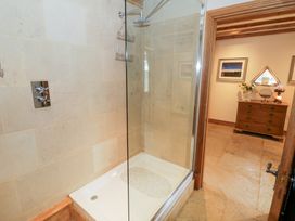 A shower enclosure with glass door in a bathroom at Rookery Hall Middle Hill near Broadway