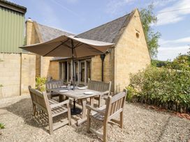 An outdoor dining area with seating at Rookery Hall in Middle Hill near Broadway