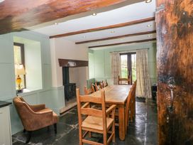 A dining room with a table and chairs at Ewedale Farm in Pennington near Ulverston