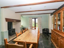 A dining room with a large table and chairs at Ewedale Farm in Pennington near Ulverston