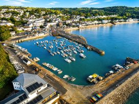 A marina with boats and a pier at 6 Coedrath Park - Swn y Mor in Saundersfoot
