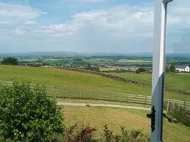 A view of a landscape with hills and fields at The Journeyman Luxury Shepherds Hut in Barnoldswick