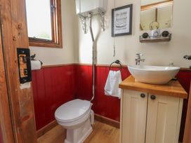 A bathroom with toilet and sink at The Journeyman Luxury Shepherds Hut in Barnoldswick