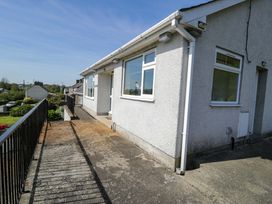 A house exterior with a balcony and pathway at Trem Y Foel Penrhyndeudraeth