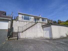 A house with stairs and a garage at Trem Y Foel in Penrhyndeudraeth