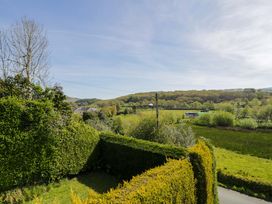 A view of trees and hedges with a road at Trem Y Foel in Penrhyndeudraeth