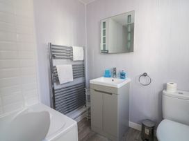 A bathroom with a sink and toilet at Crew House in Dartmouth