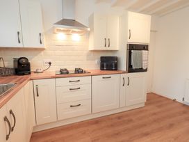 A kitchen with cabinets and appliances at Glen Lea, Giggleswick, Settle
