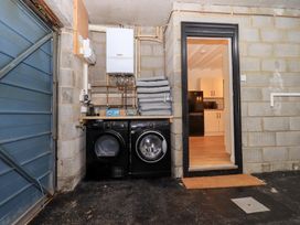 A laundry room with washing machine and dryer at Glen Lea in Giggleswick, Settle