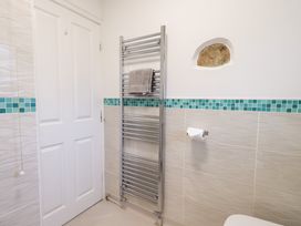 A bathroom with a towel rack and toilet at Glen Lea in Giggleswick, Settle