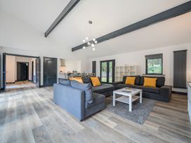 A living room with a sofa and coffee table at The Cottage in Wimborne Minster