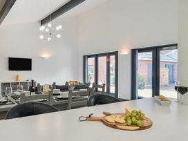 A dining room with a table and chairs at The Cottage in Wimborne Minster