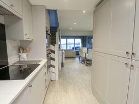 A kitchen leading to a living area at White Sails Y Felinheli