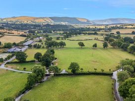 An aerial view of fields and hills at The Otter in Nantmel near Rhayader