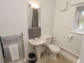 A bathroom with a sink and toilet at 1 Eamont Park Penrith