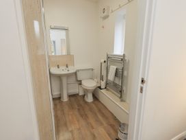 A bathroom with a sink and toilet at 1 Eamont Park in Penrith