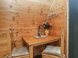 A dining area with a table and chairs at Beech in Ulverston