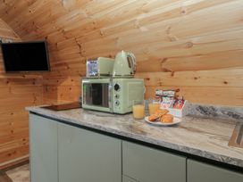 A kitchen with a kettle and microwave at Beech in Ulverston