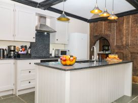 A kitchen with an island and appliances at The Abbey Grange near Charmouth
