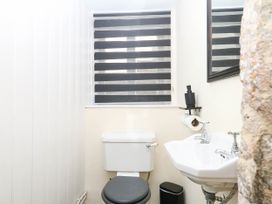 A bathroom with toilet and sink at The Abbey Grange near Charmouth