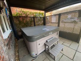 An outdoor area with a hot tub and steps at The Hollies in Thurstonfield near Carlisle