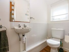 A bathroom with a sink and toilet at Y Berth in Caernarfon