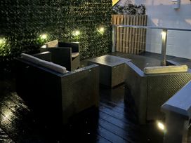 An outdoor seating area with furniture at Y Berth in Llanberis