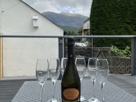 An outdoor table with Prosecco and glasses at Y Berth in Llanberis