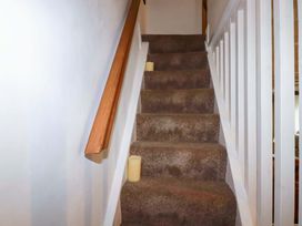 A staircase with candles along the steps at Woodview in Looe