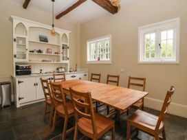 A dining room with a table and chairs at Kexby House