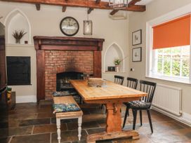 A dining room with a table and chairs at Kexby House