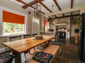 A kitchen with a dining table and chairs at Kexby House 