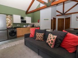 A kitchen with a sofa and appliances at Kexby House