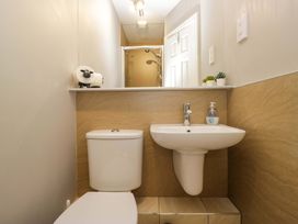 A bathroom with a toilet and sink at Beckmead in Windermere